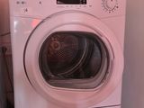 two washers and a dryer stacked on top of each other