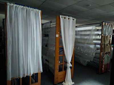 a room that has a bunch of curtains on the wall