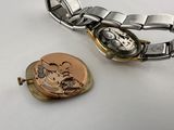 a watch that is sitting next to a watch
