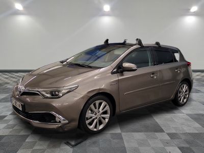 the toyota sienna is parked on a checkered floor in a garage
