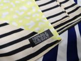 a close up of a striped shirt with a polka dot on it