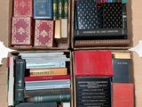 boxes of books are stacked on top of each other in a cardboard box
