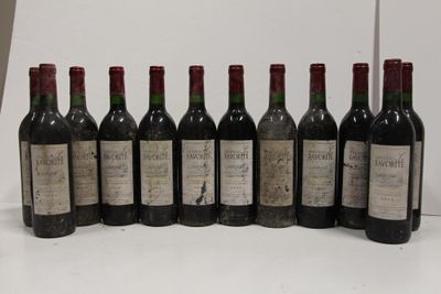 six bottles of wine are lined up in a row on a table