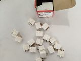 a box of small pieces of electrical equipment on a table