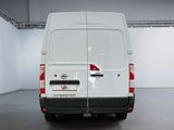 the rear end of a white van parked in a garage