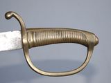 a close up of a sword that is on display