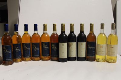 many bottles of wine lined up on a table