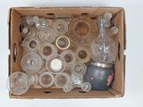 a box full of empty glasses and bottles on a table