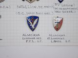 several badges on a piece of paper with writing on it