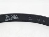 a close up of a black belt on a white surface
