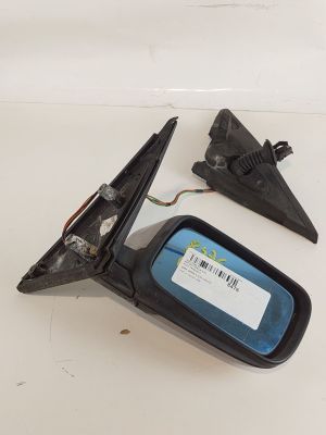 a close up of a car side view mirror with a sticker on it