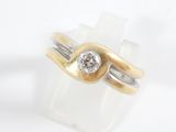 a picture of a gold and silver ring with a diamond