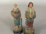 paire de figurines en céramique représentant un homme et une femme
