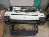 a printer sitting on top of a table in a room