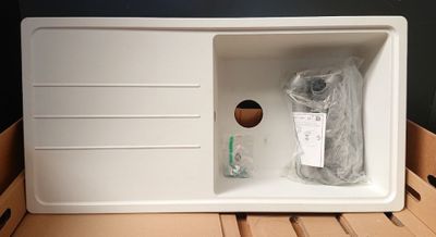 a white box with a toothbrush inside of it
