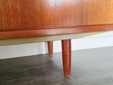 a wooden cabinet with a drawer on top of it