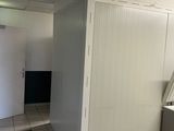 an image of a kitchen with a refrigerator and a washer