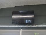 a flat screen tv mounted on the ceiling of a garage