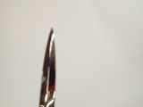a pair of scissors that are on a table