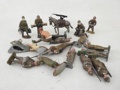 a lot of toy soldiers that are laying on the ground