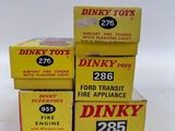three boxes of dinky toys are stacked on top of each other