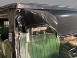 a green car that is parked in a garage
