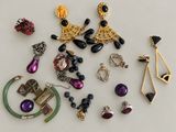 many different types of jewelry on a white surface