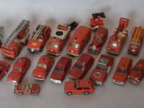 a lot of toy firetrucks that are on a table