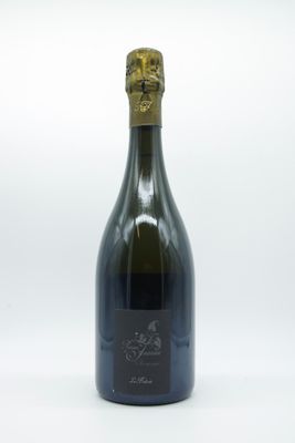 the bottle of wine is empty on a white surface