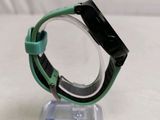 a watch that is sitting on a stand on a table