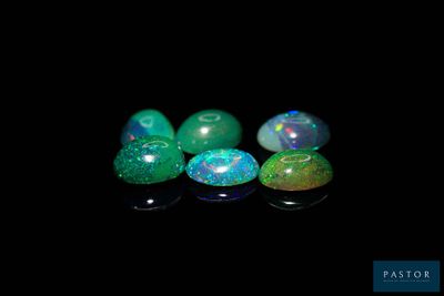four oplites in a row on a black surface