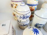 many vases that are sitting on a table