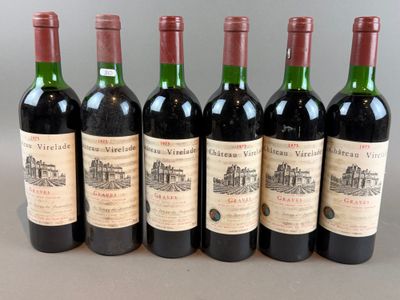 six bottles of wine are lined up in a row on a table