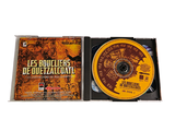 a cd in a box with a yellow label on it