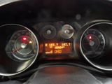 a close up of a car dashboard with a clock on it
