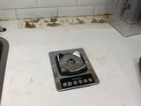 a small scale sitting on a counter in a kitchen