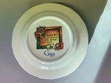 a white plate with a picture on it on a table