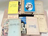 several books are stacked on top of each other on a table