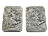 pair of two silver coin with a woman and a bird on it