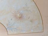 a painting on the ceiling of a room with a fan