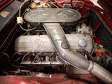 a close up of a car ' s engine with the hood open