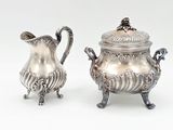 pair of antique silverplated sugar and creamers on stands