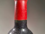 a bottle of wine that is sitting on a table