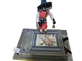 a figurine of a pirate on top of a book