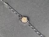 an image of a watch sitting on top of a table