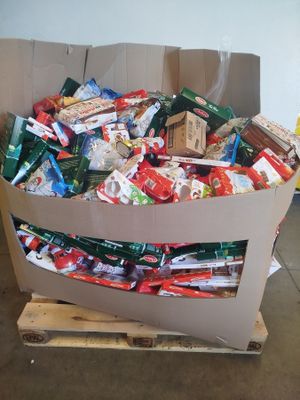 a box full of candy and candy bars on a pallet