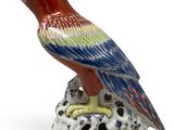 an image of a figurine of a bird on a rock