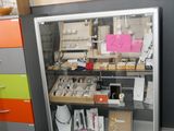 a glass display case in the middle of a room