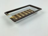 a tray with a chess board on it on a table