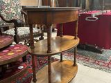 an image of a three tiered table in a room